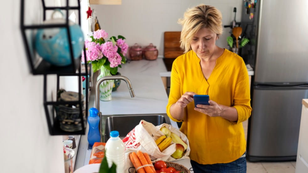 woman budgeting in kitchen